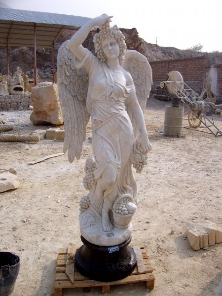 Marble sculpture of an angel with a vine