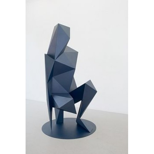 Polygonal sculpture of a woman squatting