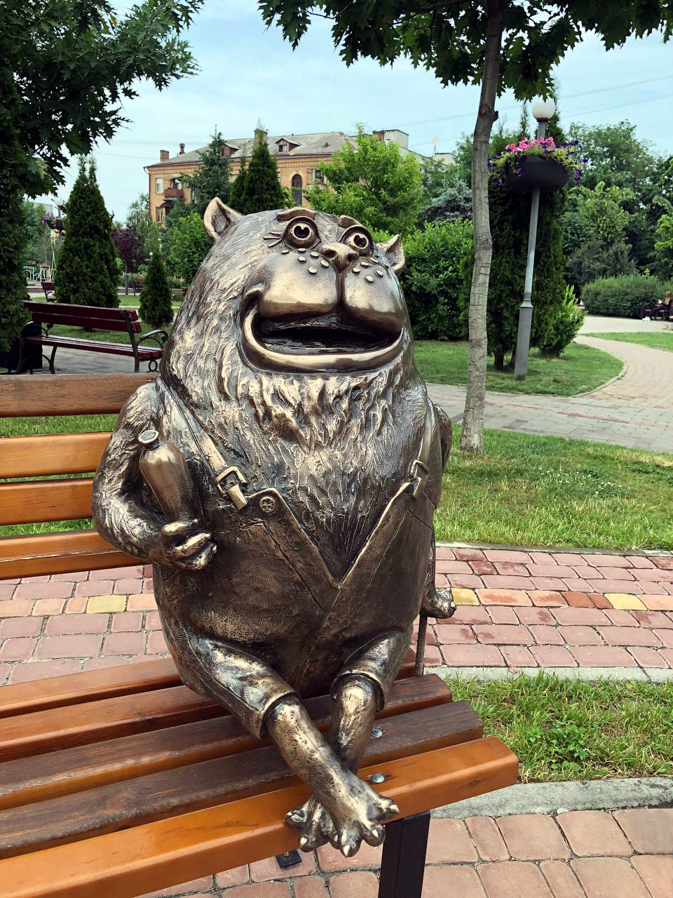 Bronze sculpture of a cat from the cartoon about the parrot Kesha