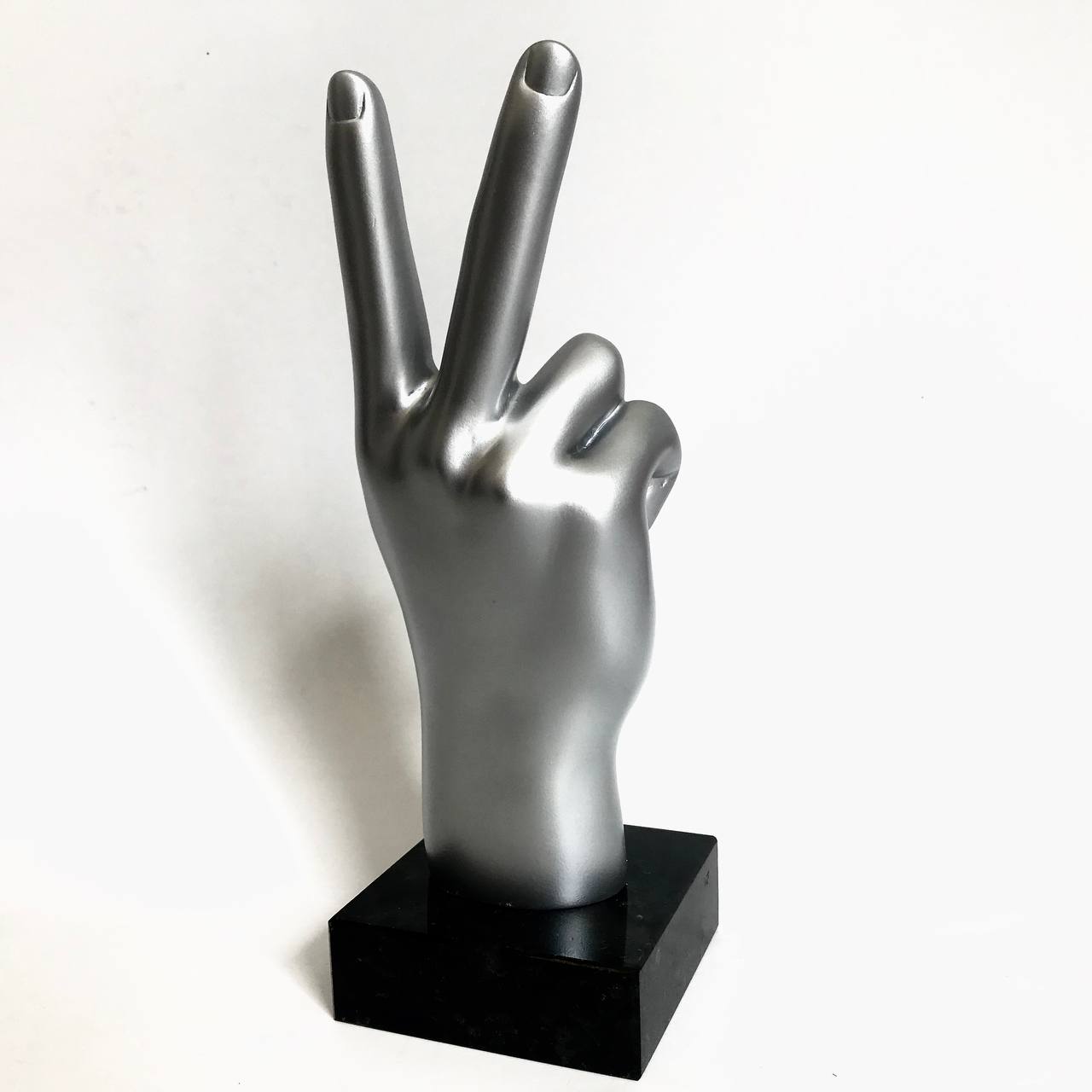 figurines in the form of a Peace gesture
