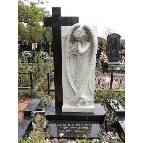 Monument with an angel and a cross on the grave